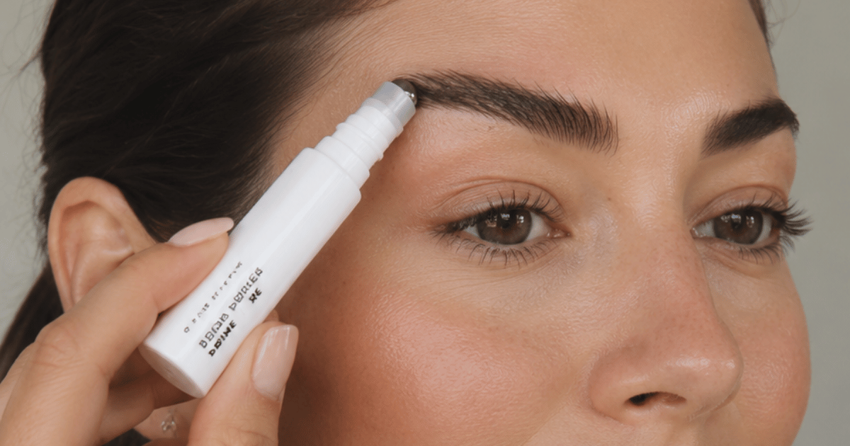 woman using brow primer