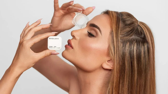 a woman holding clean girl brow slick