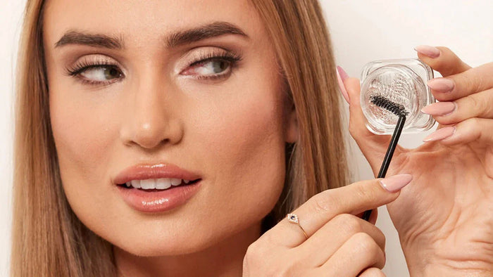 a woman using clean girl brow slick brow wax