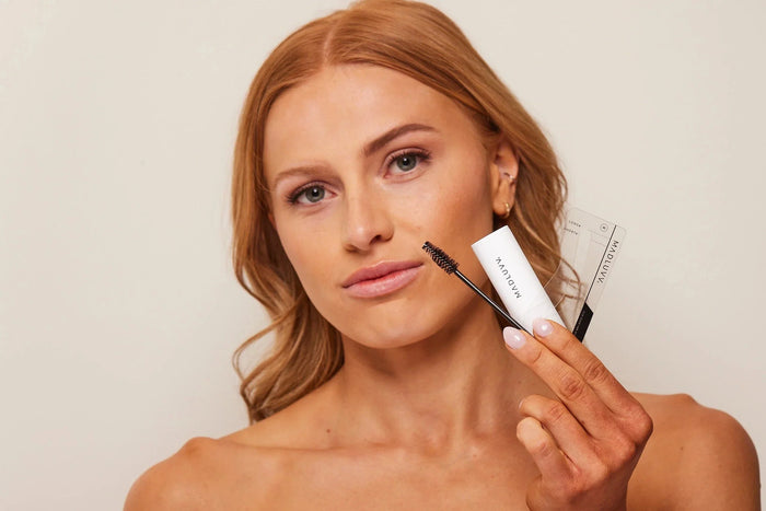 Woman holding Madluvv Brow Stamp Kit