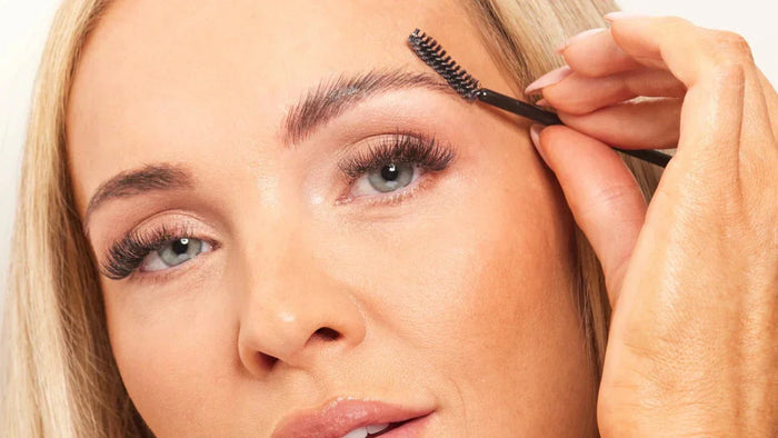 Woman using brow wax